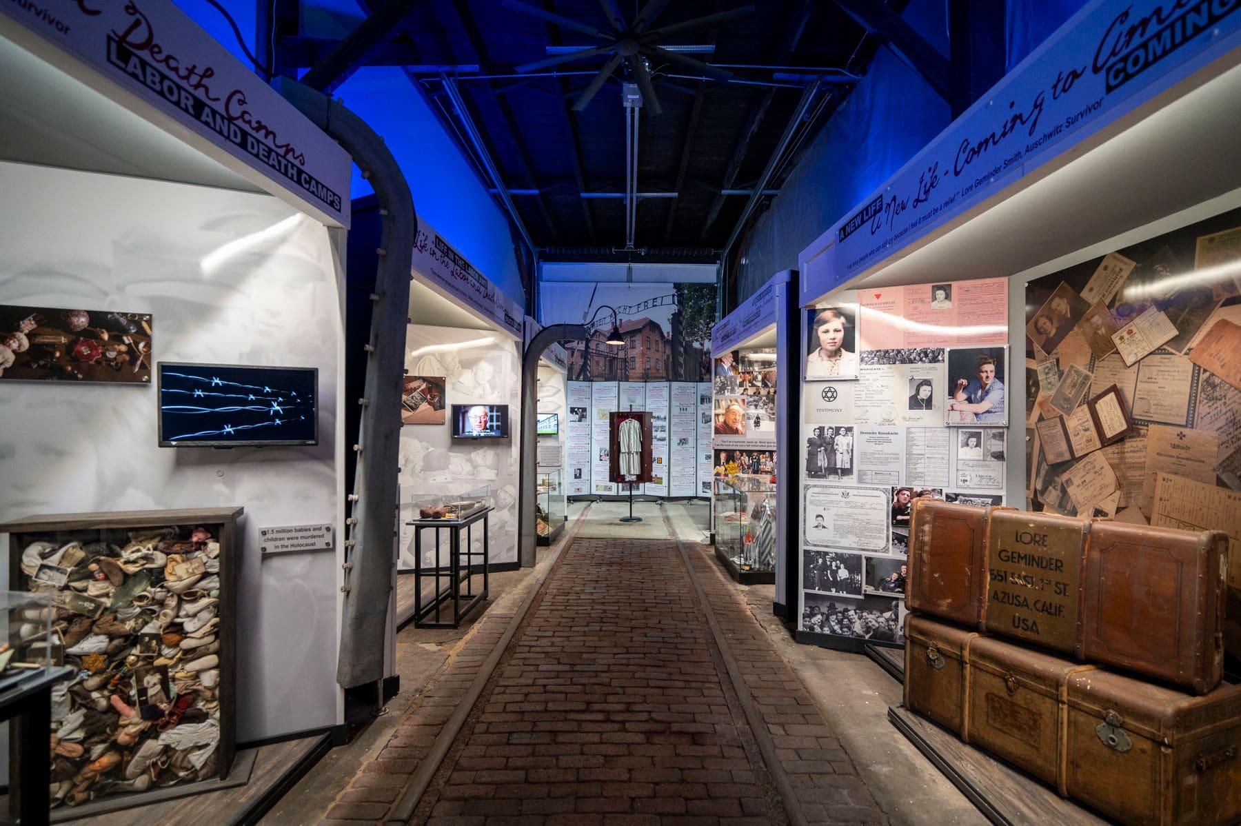 Brick walkway between Holocaust history displays inside the exhibit