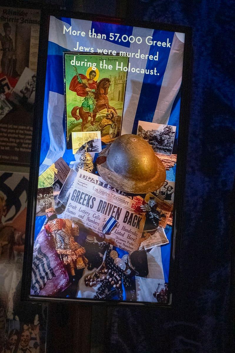 Books, photographs, and artifacts in a Holocaust education display
