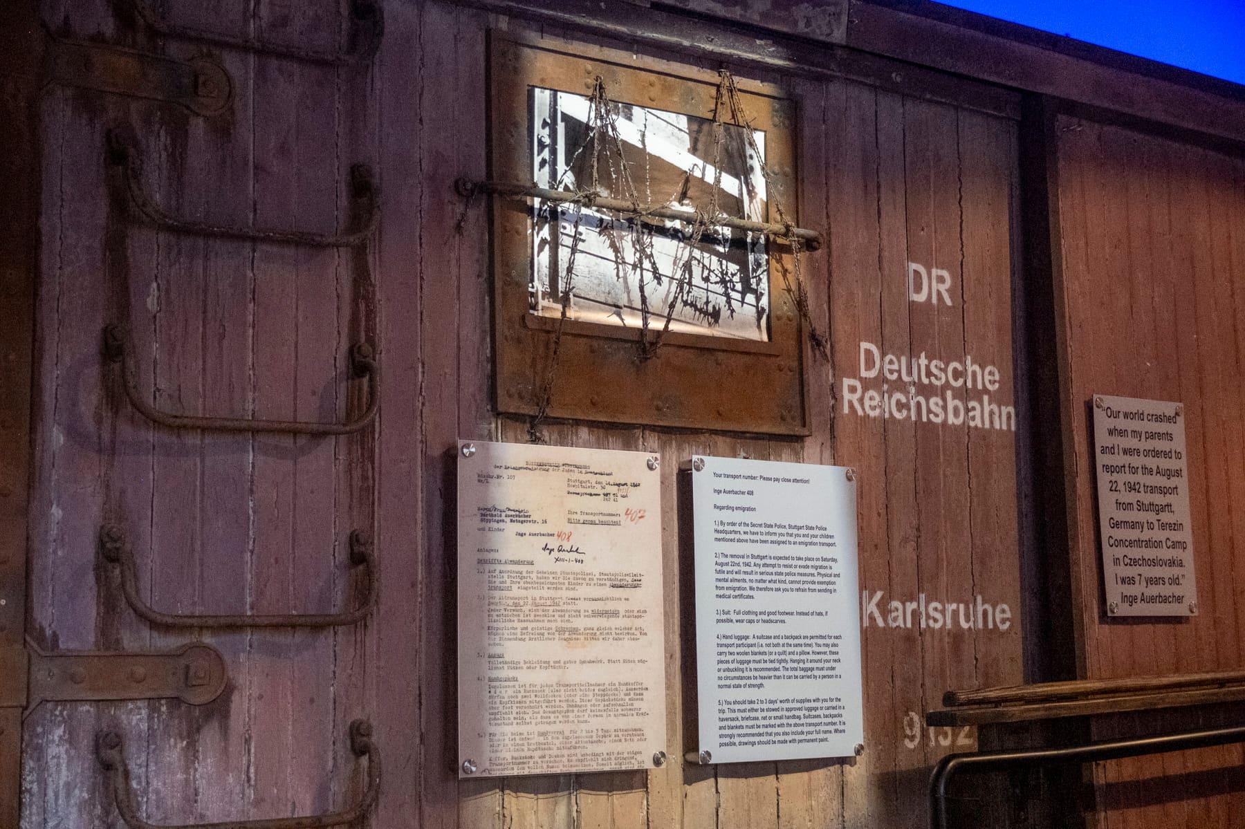 Deutsche Reichsbahn railcar markings beside historical interpretation panels