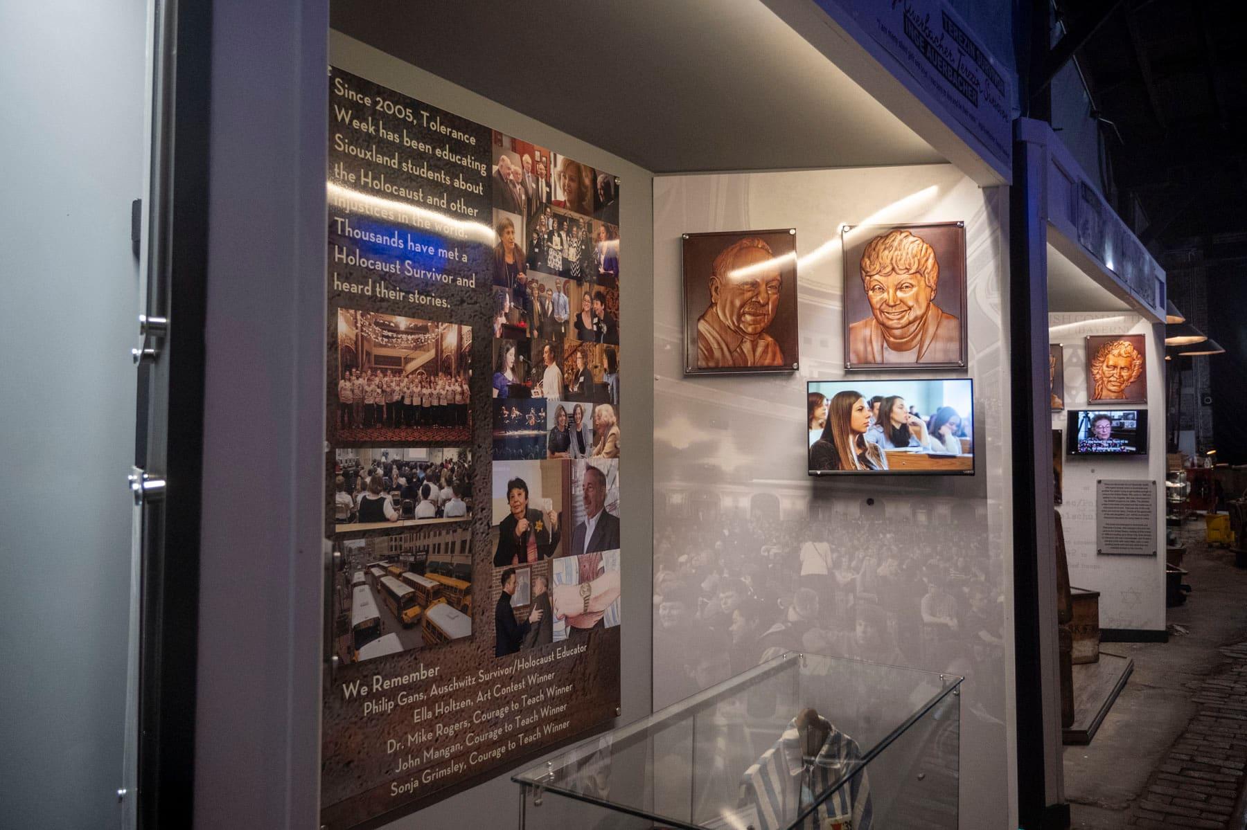 Historical wall panels and video displays inside Holocaust Rails