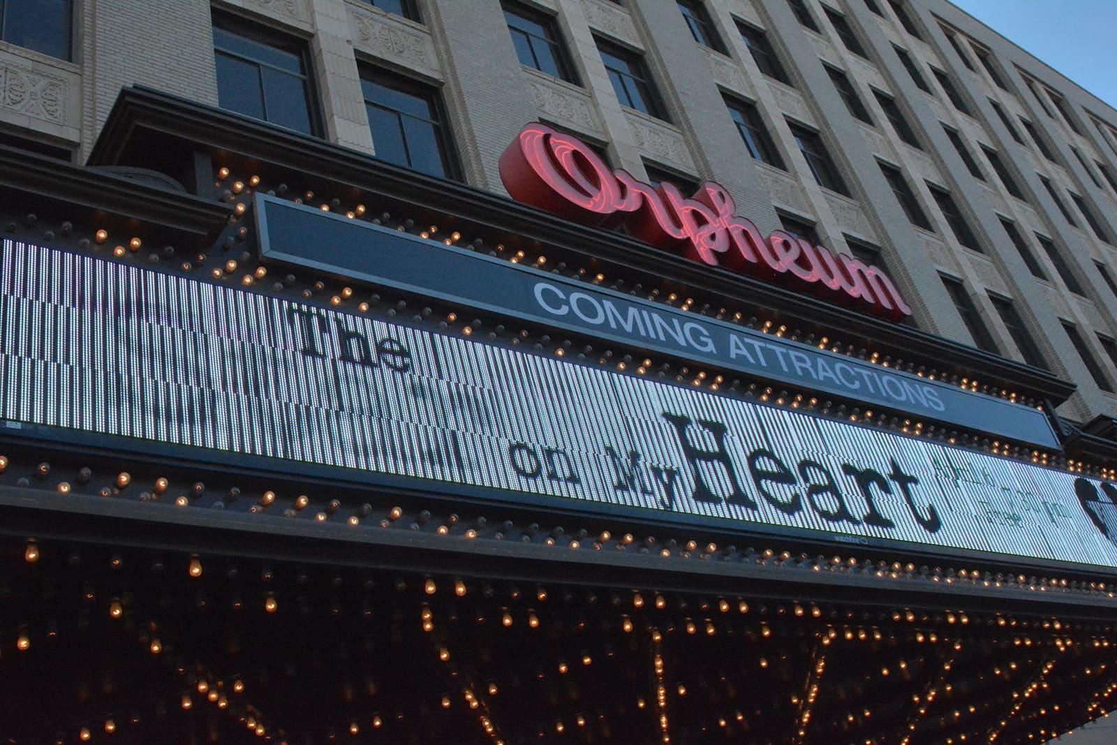 A theater marquee displays “The Star on My Heart.”