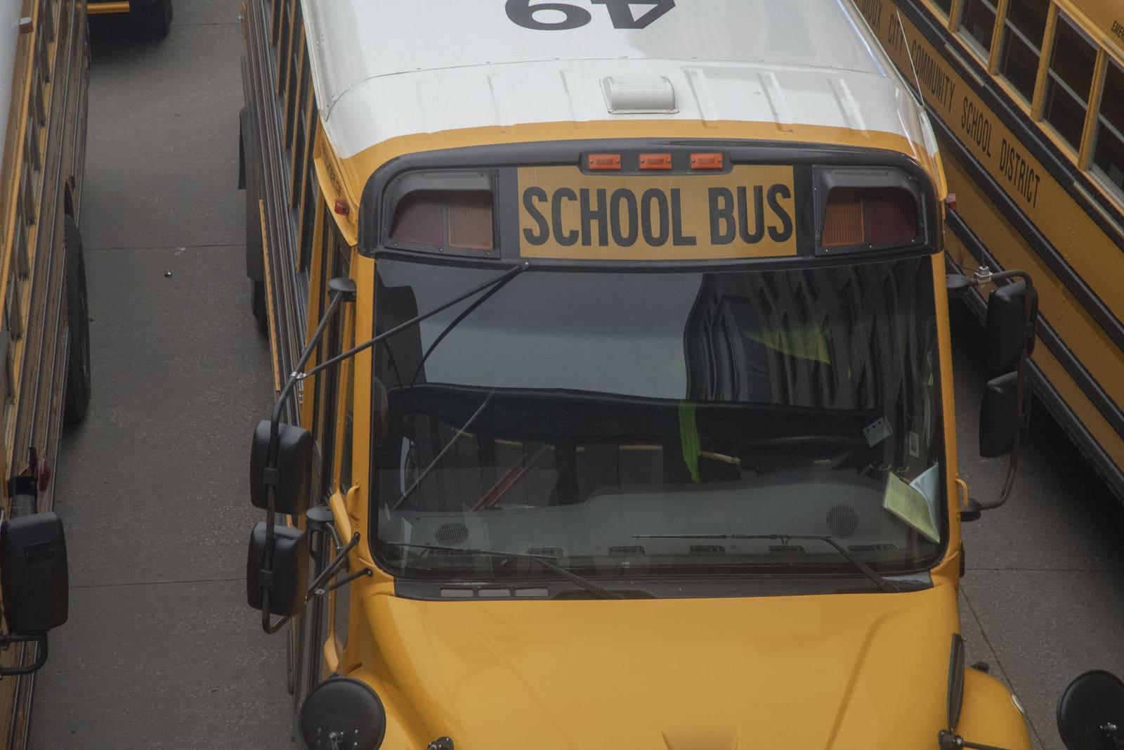 Close-up of the front of a yellow school bus.
