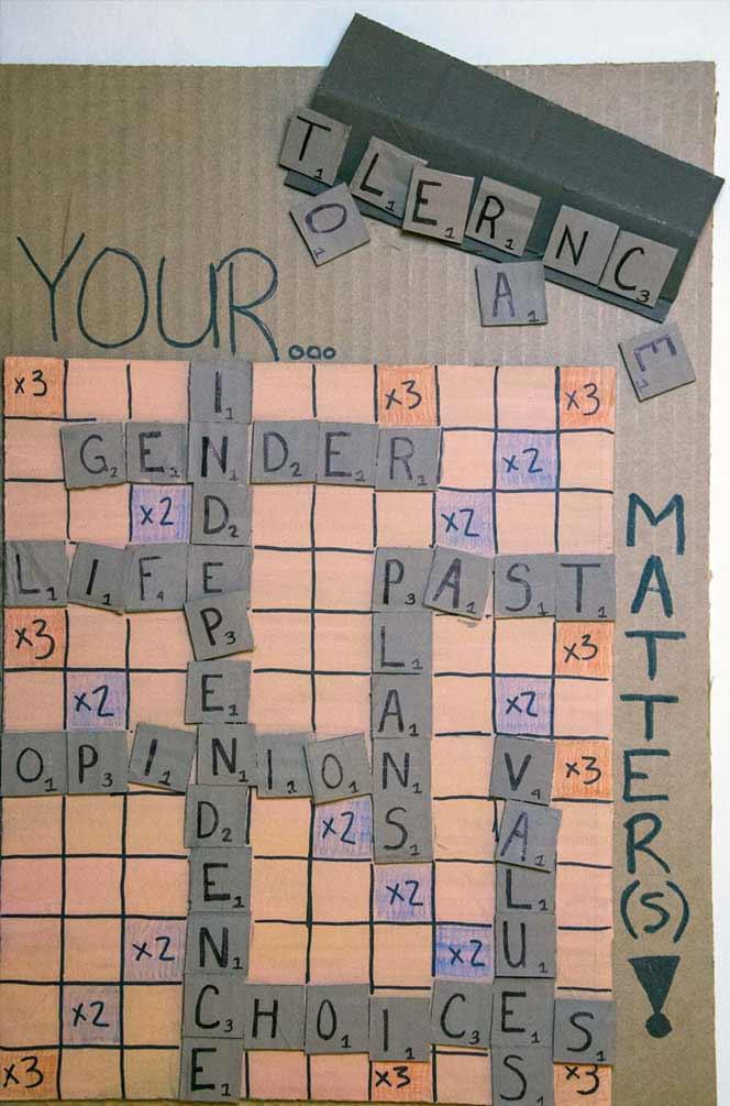 Crossword-style artwork spells words about tolerance, gender, and choices.