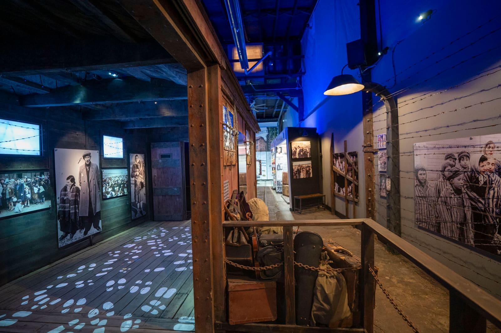 Blue lighting illuminates a corridor of historical displays.