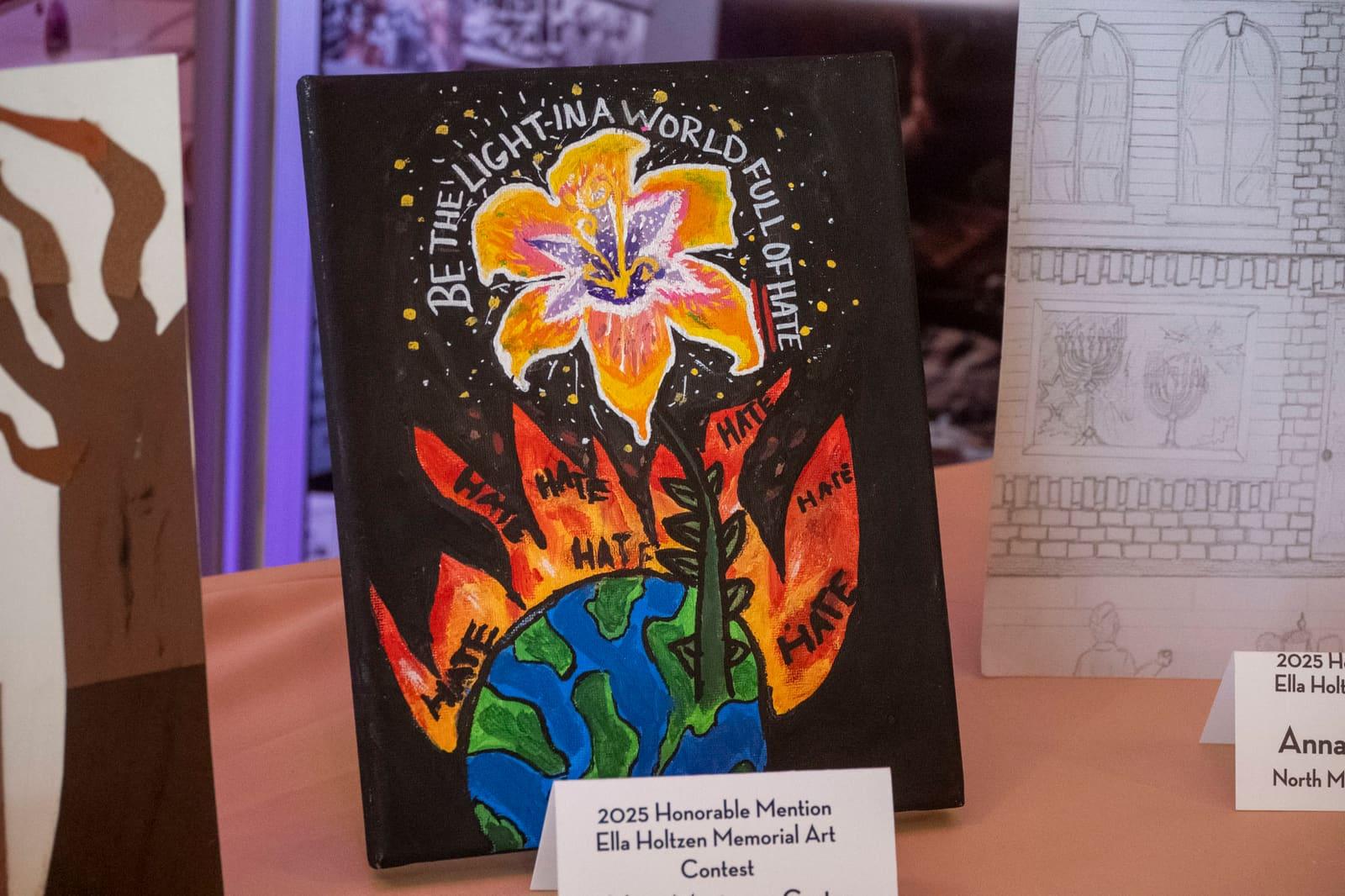 A bright flower-and-globe artwork stands beside a pencil architectural drawing.