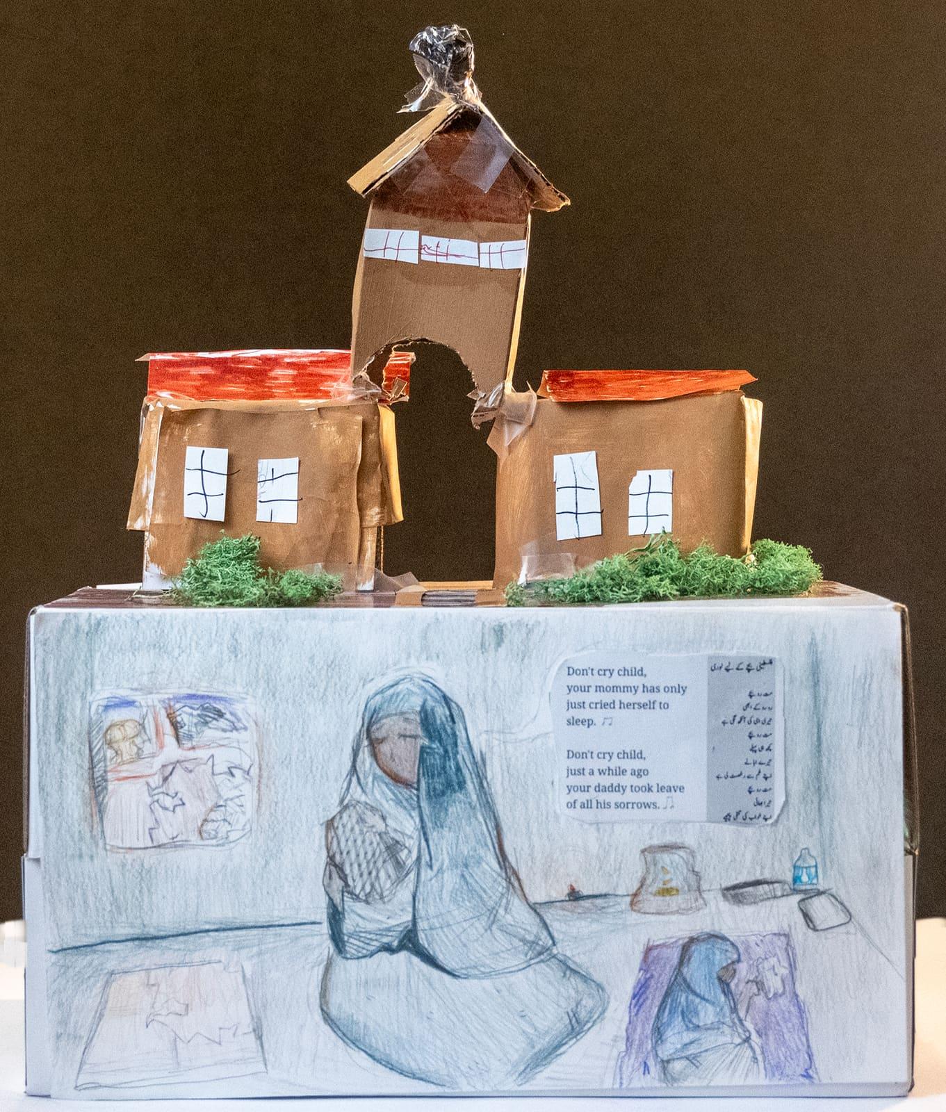 Three-dimensional artwork shows model buildings above illustrated portraits and text.