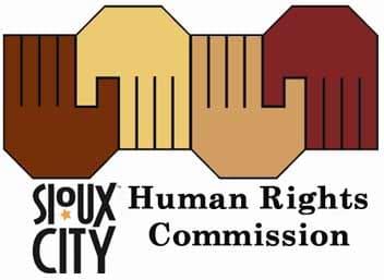 Sioux City Human Rights Commission logo with black name text beneath brown, tan, and red building shapes.
