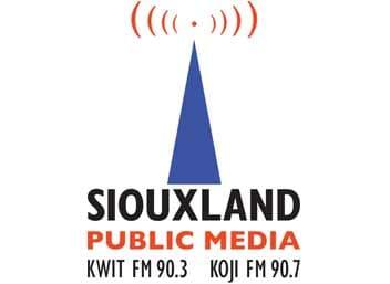 Siouxland Public Media logo with black and orange name text, a blue broadcast tower, and red signal arcs.